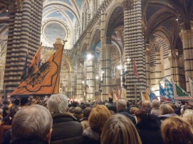 Inside the Duomo of Siena for mass to celebrate Sant'Ansano and the contrade.